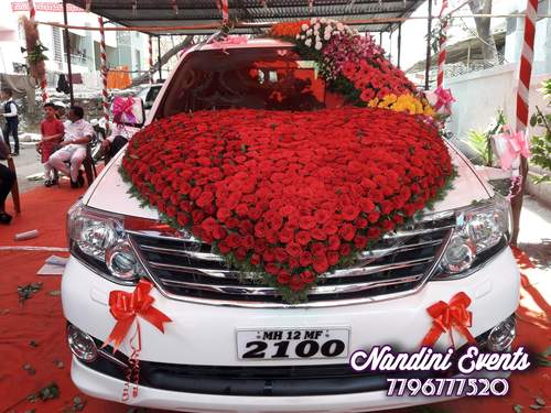 Extravagant floral wedding car decoration